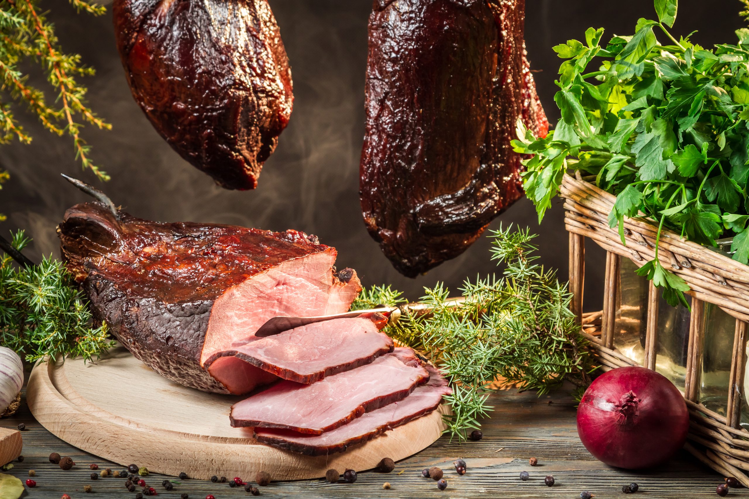 Freshly smoked ham in homemade smokehouse